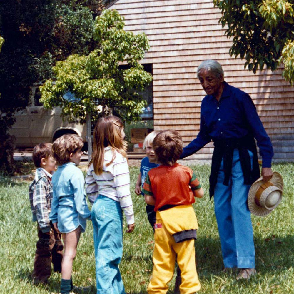 colour-photograph-of-j-krishnamurti-among-children-holding-a-hat.jpg