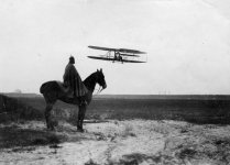 A German mounted soldier and an early airplane.jpeg