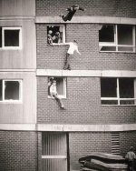 Children bouncing on worn out mattresses in England, 1980s.jpeg